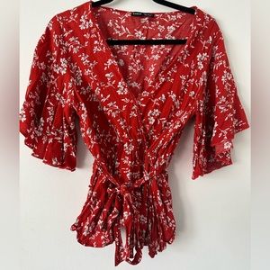 Red floral blouse